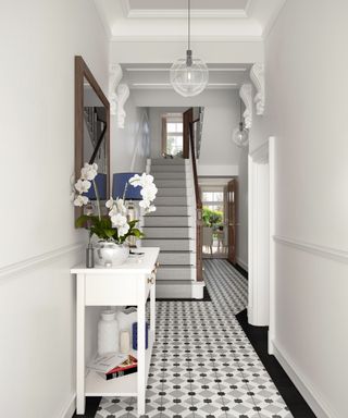 black and white hallway with white console table