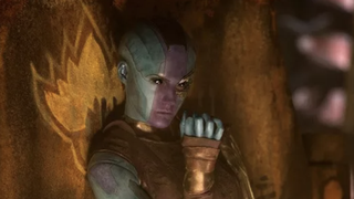 Karen Gillan as Nebula, eating fruit in Guardians of the Galaxy