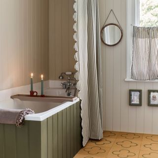 bathroom with decorative cork flooring green panelled bath and frilled shower curtain