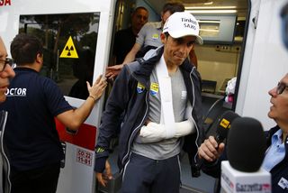 Alberto Contador is swamped with media wanting to know the extent of his injuries