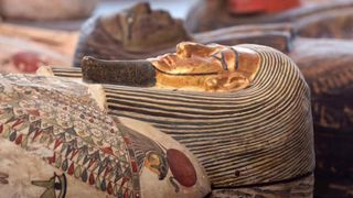 A close-up showing one of the mummy filled coffins. The            colors are remarkably well preserved despite the passage of            over 2,000 years of time.