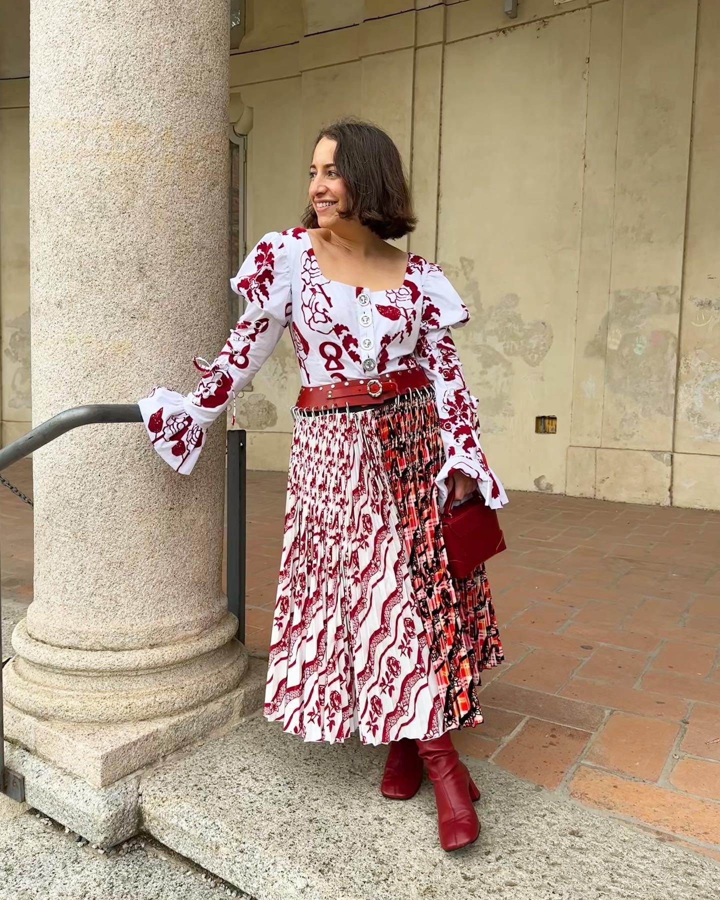 how to wear a kilt: Hannah Almassi wears a chopova lowena dress, and red leather boots