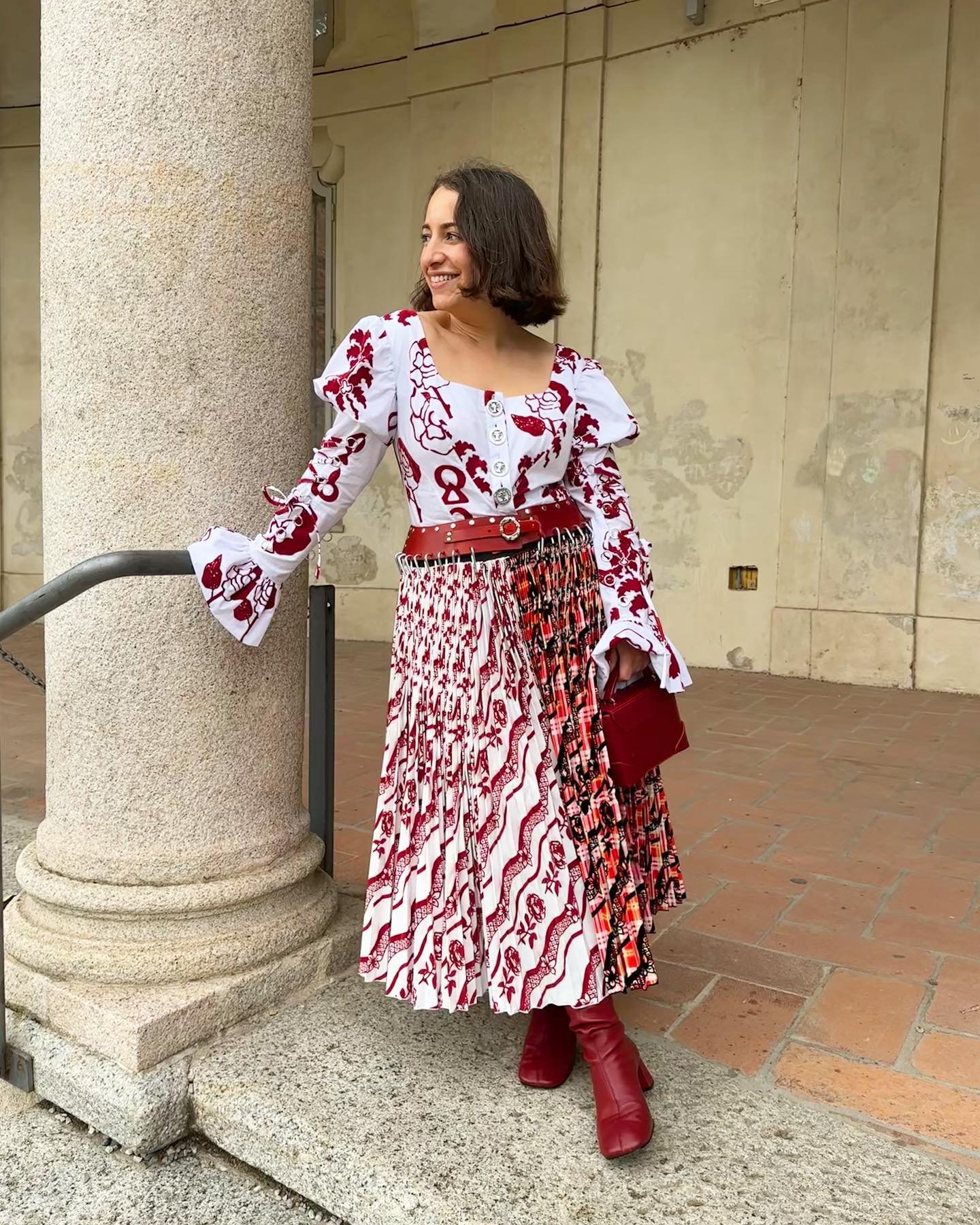 how to wear a kilt: Hannah Almassi wears a chopova lowena dress, and red leather boots