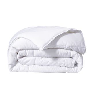 A rolled up white comforter