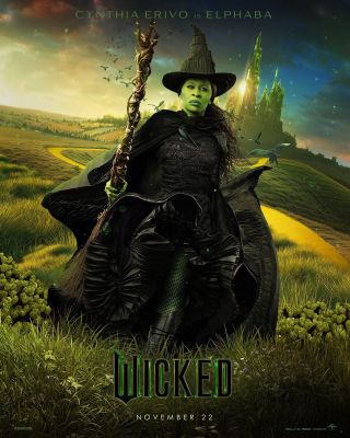 Cynthia Erivo Wicked poster in black Wicked Witch costume heading away from the Emerald city