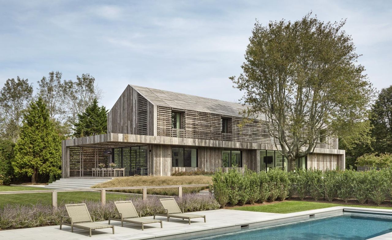 hero exterior view of timber clad Hamptons house