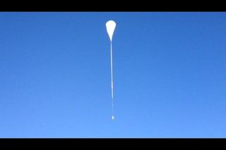 A giant zero-pressure NASA balloon soars skyward carrying the Balloon Rapid Response for ISON telescope into the upper atmosphere on a mission to observe Comet ISON. The balloon took off from Fort Sumner, N.M., on Sept. 28, 2013.