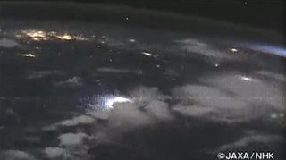 Screenshot of video showing lightning, airglow and the sunrise from the International Space Station taken and downlinked in real time via the SS-HDTV camera.