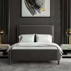 A Saatva bed in a black and gray bedroom