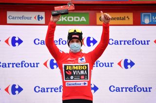 OURENSE SPAIN NOVEMBER 04 Podium Primoz Roglic of Slovenia and Team Jumbo Visma Red Leader Jersey Celebration Trophy Mask Covid safety measures during the 75th Tour of Spain 2020 Stage 14 a 2047km stage from Lugo to Ourense lavuelta LaVuelta20 La Vuelta on November 04 2020 in Ourense Spain Photo by Justin SetterfieldGetty Images