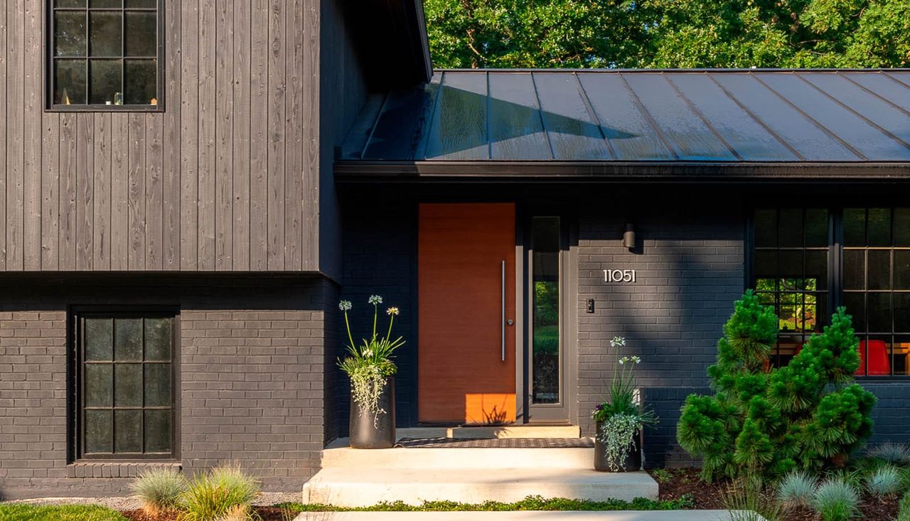 Modern home with simple modern planting in the front yard