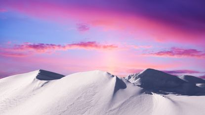 Winter Solstice horoscope: Snowcapped mountains at sunset.