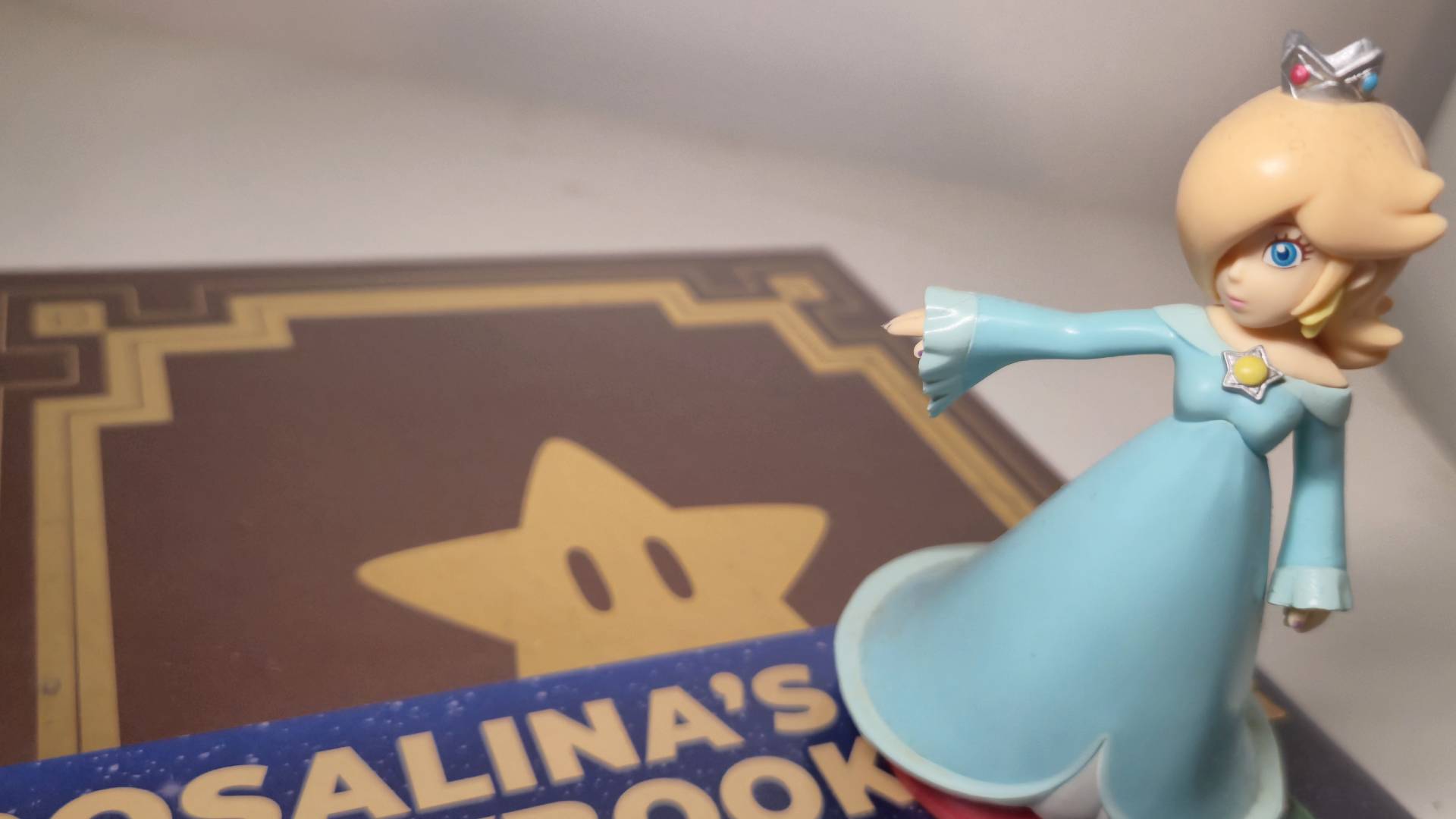 Photo of a Rosalina amiibo sitting on Rosalina's Storybook.
