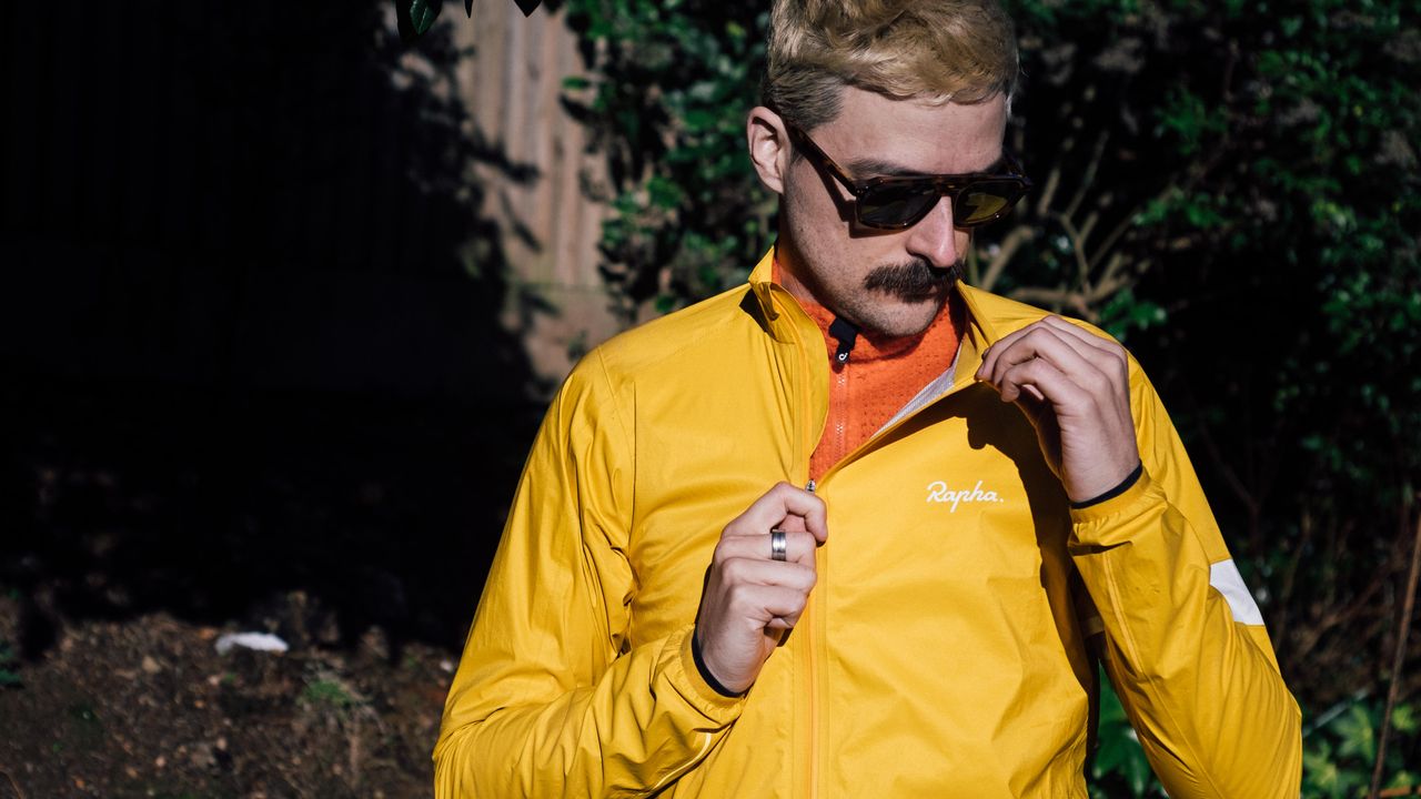 A yellow rapha core waterproof jacket
