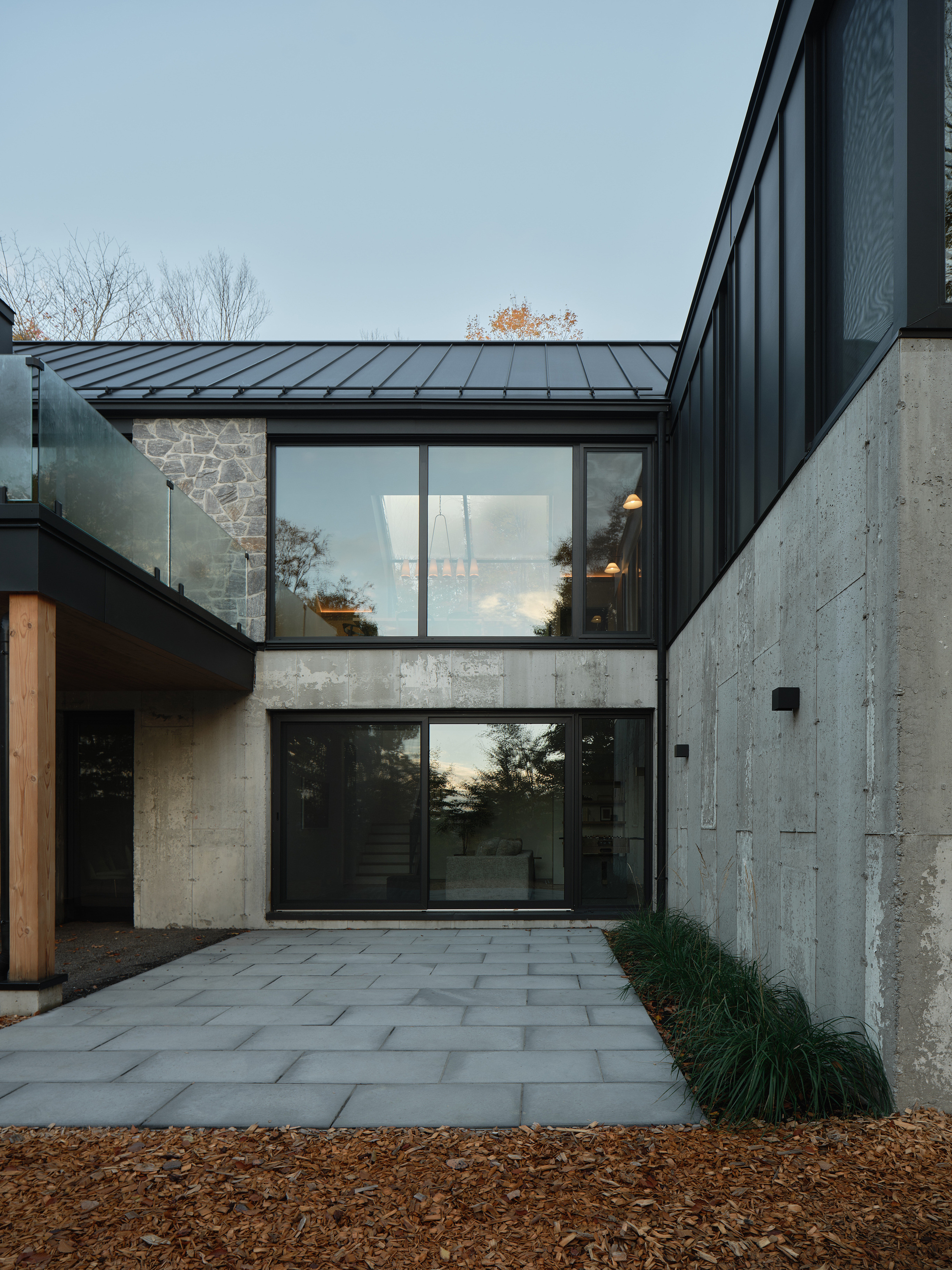 The concrete ground floor encloses a small courtyard
