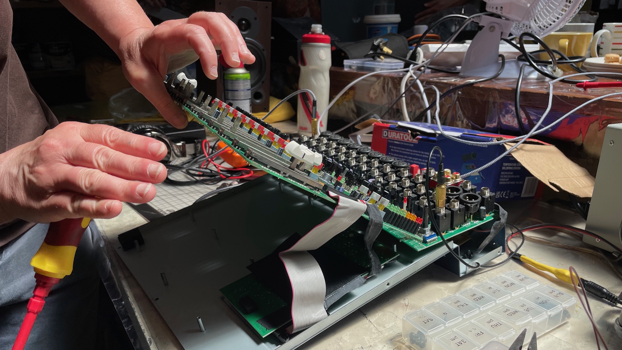 A Soundcraft mixer being taken apart.