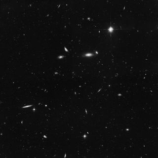 This view from the Hubble Space Telescope zeroes in on a small, random location of the sky that is filled with distant spiral galaxies. The image was taken with Hubble's Advanced Camera for Surveys while Hubble's Wide Field Camera 3 was imaging NGC 4302 and NGC 4298. (Space telescopes can multitask, too!) 