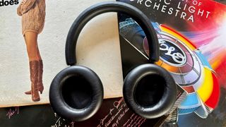 Philips Fidelio L4 noise-cancelling headphones lying flat on records with inside of earcups facing up