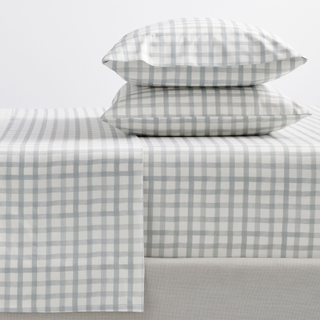 sheets and two pillows in white and gray plaid