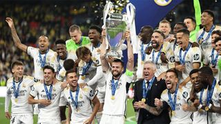 Real Madrid captain Nacho holds the Champions League trophy aloft after his team&#039;s victory over Borussia Dortmund in the 2024 final.