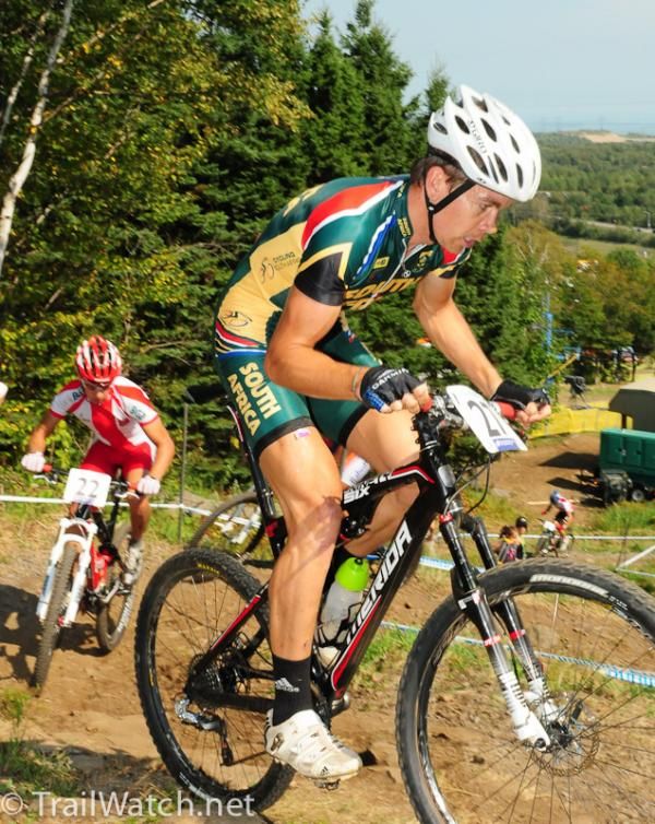 South African rider Phillip Buys rides uphill switchbacks in 24th place