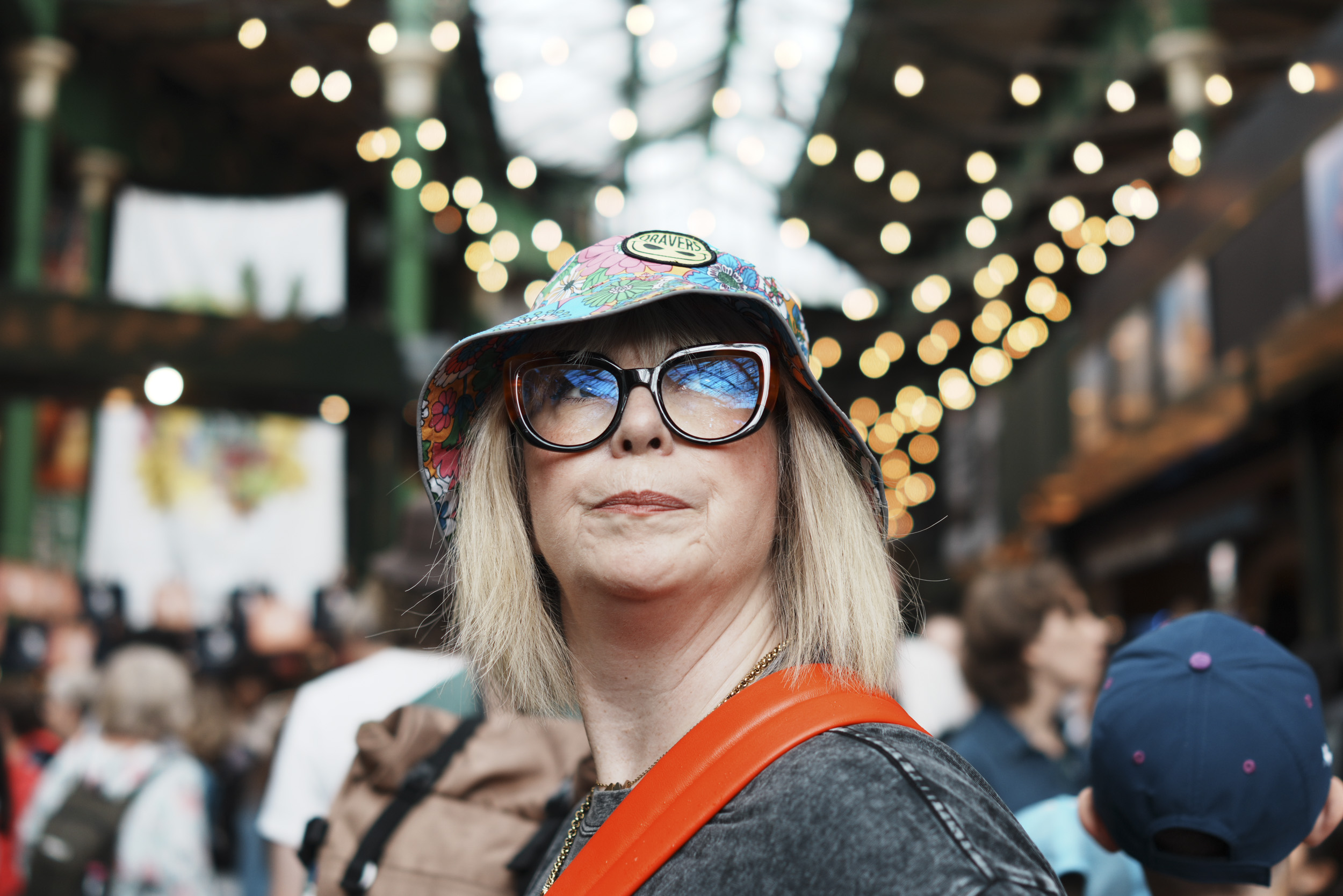 Sony RX1R III sample gallery: person looking up in a crowded market