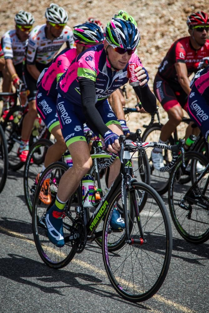 Chris Horner (Lampre-Merida) gets a drink out on the road