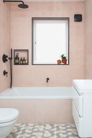 pink tiles in bathroom with window