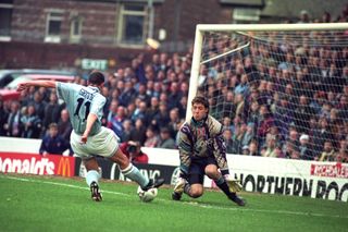 Ipswich Town goalkeeper Craig Forrest goes one-on-one against Manchester City's Carl Griffiths, 1994