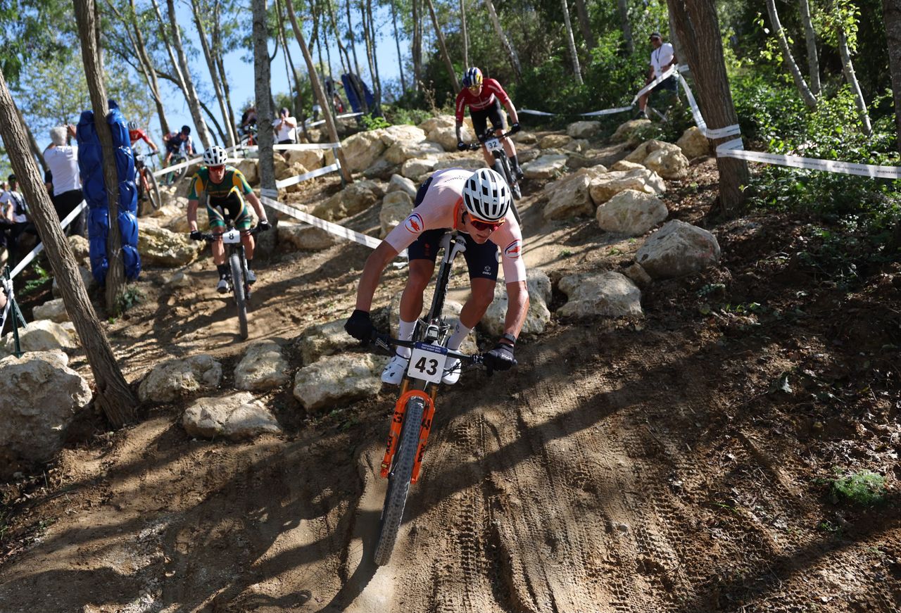 Mathieu van der Poel rides his mountain bike in 2024