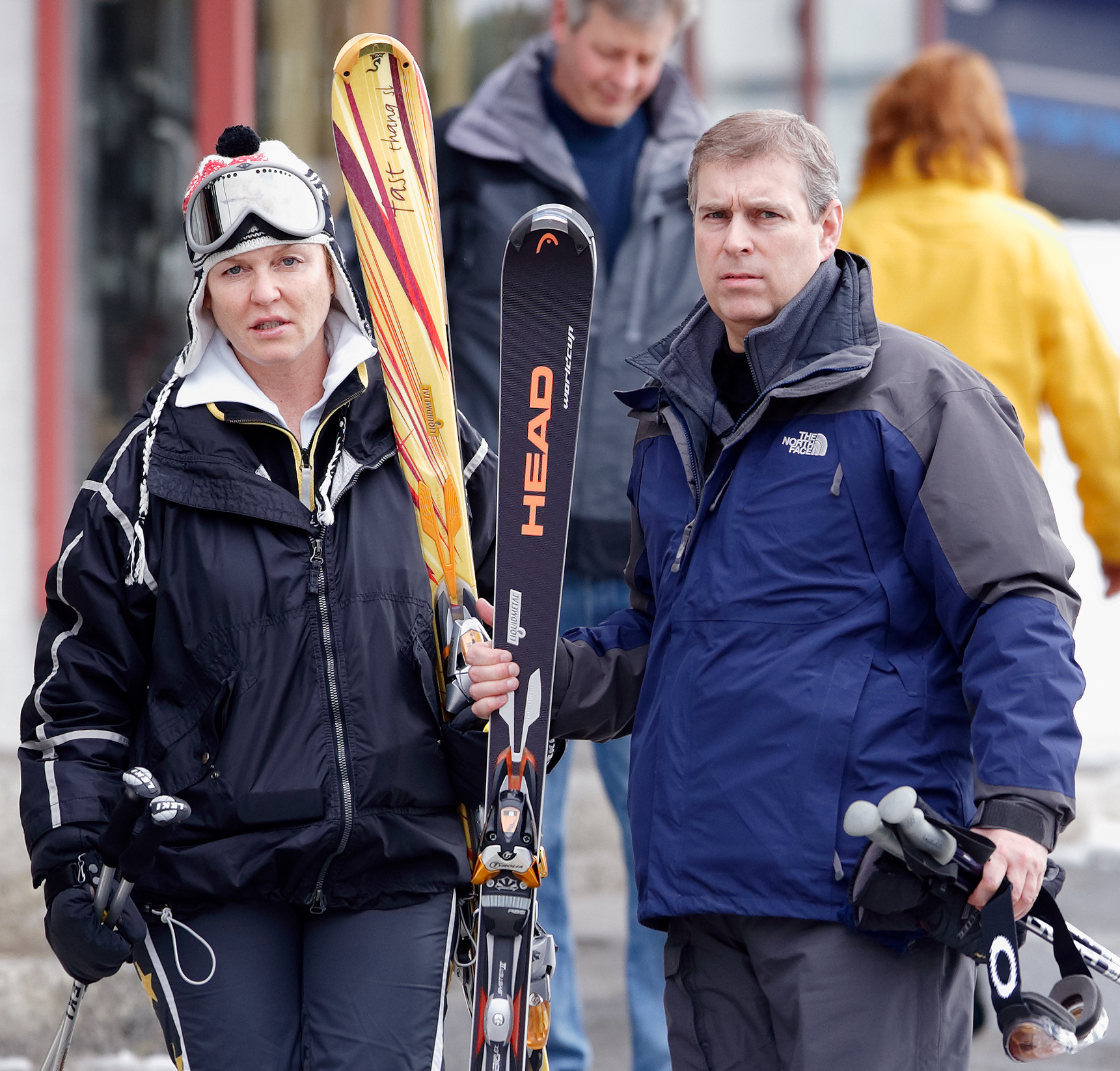 Sarah Ferguson and Andrew Mountbatten-Windsor wearing ski gear and holding skis