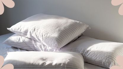 Picture of pillows on a bed to support the Tiktok viral pillow cleaning hack experts are puzzled by 
