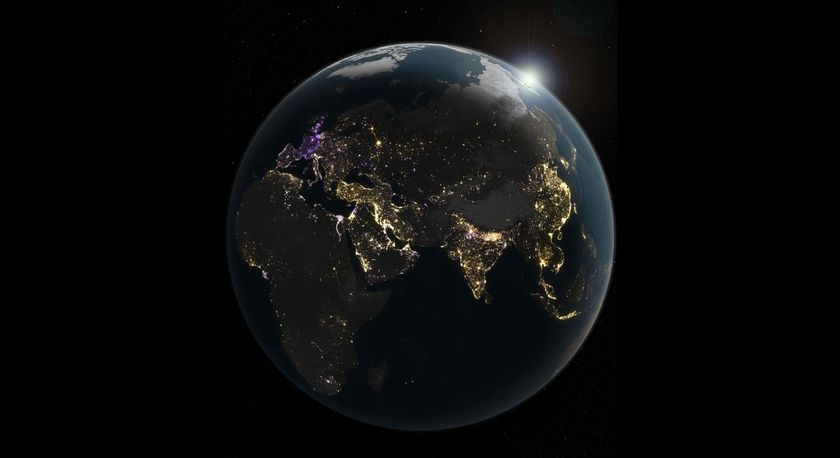 an illustration of earth at night. the planet is mostly black and in shadow, revealing patterns of dots of light tracing the outlines of continents