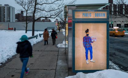 Installation view of Aya Brown's portrait "MIKEY" FIRE LIFE SAFETY ACCOUNT MANAGER, part of her COVID-19, 2020 series installed at a Brooklyn bus stop