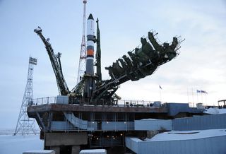 A Russian Soyuz rocket carrying the Progress 69 cargo ship stands atop its launchpad at the Baikonur Cosmodrome in Kazakhstan.