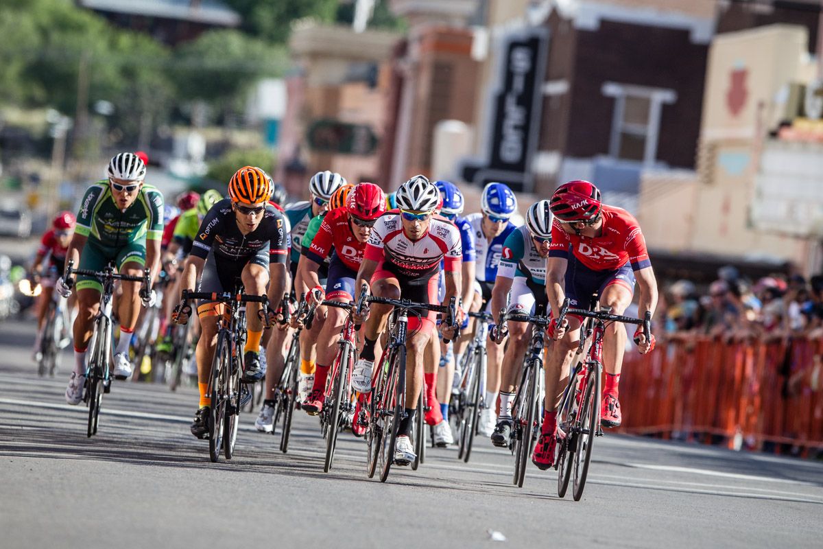 Riders start to look around with one lap to go.