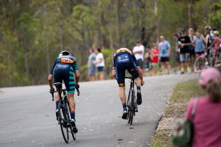 Image shows riders racing in a crit race
