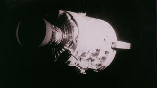 Apollo 13 service module against the black background of space.