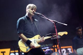 ben gibbard of death cab for cutie playing a yellow guitar performing at Not So Silent Night concert in 2018