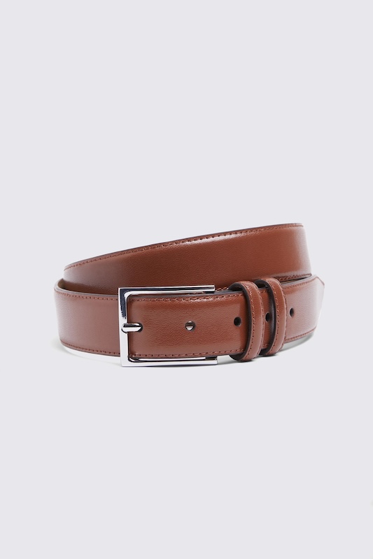 Brown leather belt rolled up with a silver buckle 