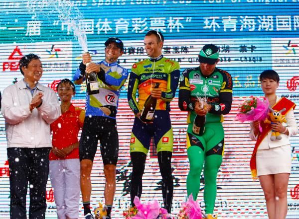 Winners with the champagne celebration at podium