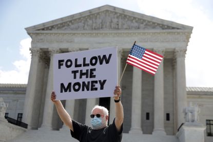 A protester in front of the Supreme Court