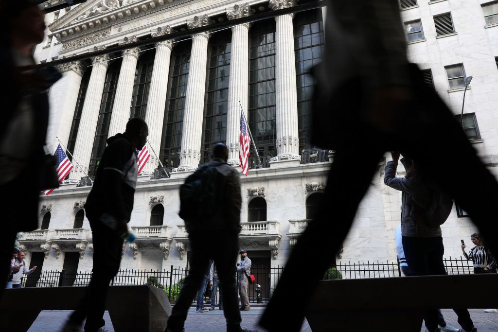 People walking outside the New York Stock Exchange.