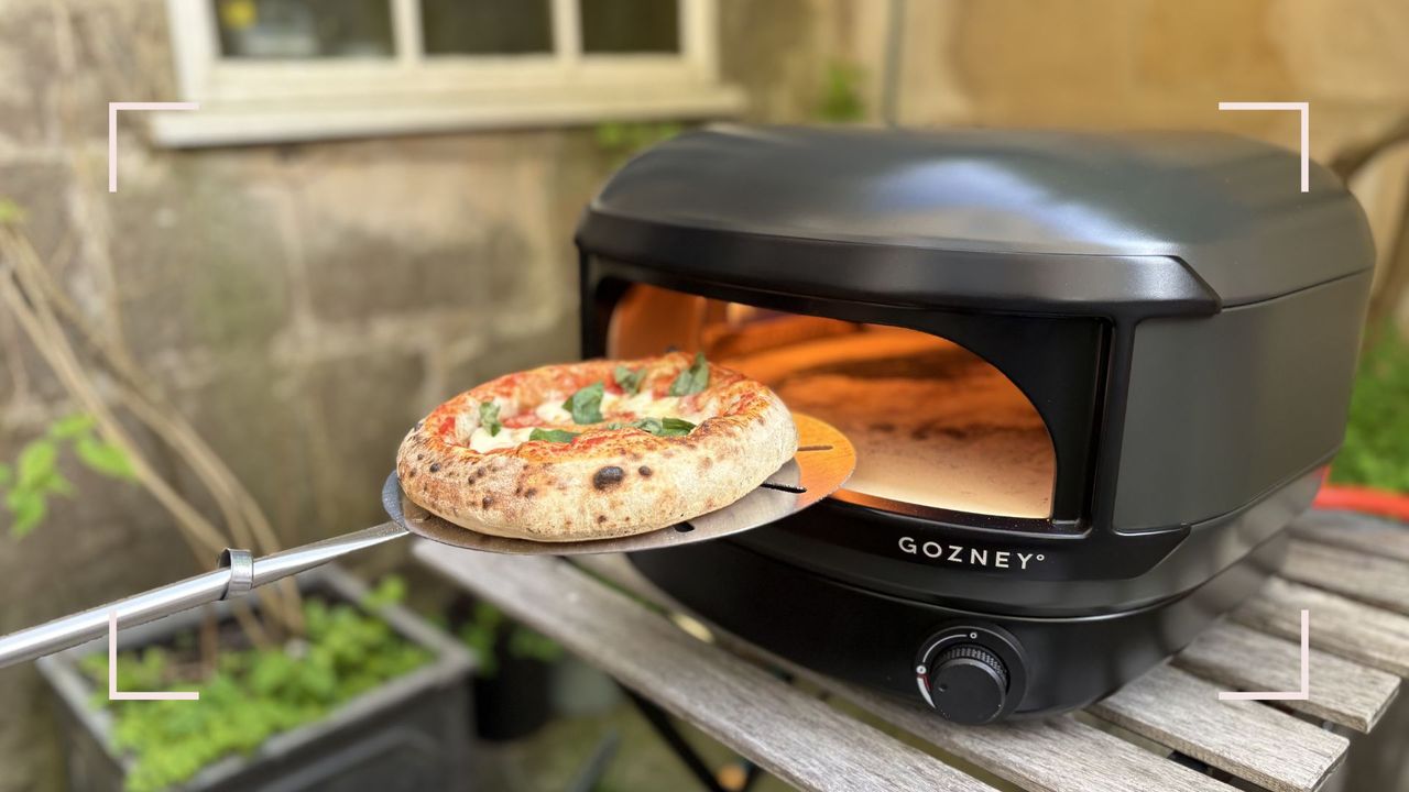 Gozney Arc Lite Pizza Oven with a pizza being cooked inside it