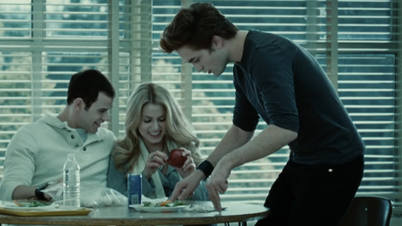 Robert Pattinson sitting down in cafeteria in Twilight