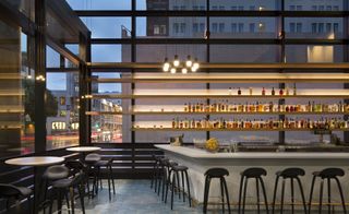 Bar area with stools and tables