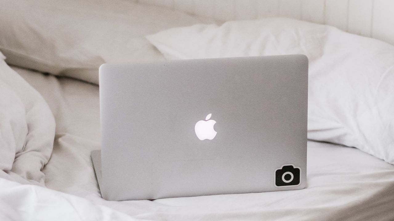 WFH posture mistakes: Macbook on bed