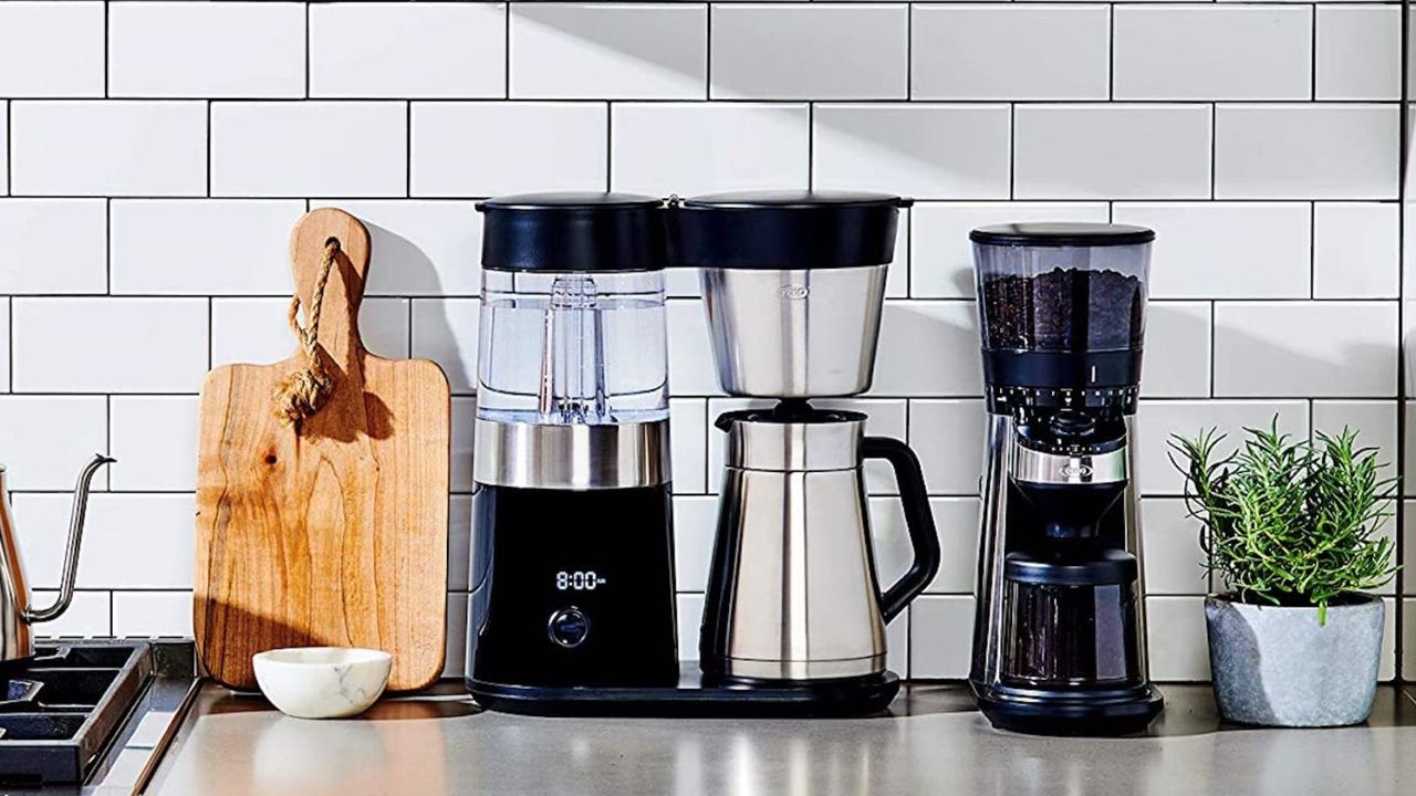 OXO 9-cup coffee maker on the countertop in front of white wall tiles