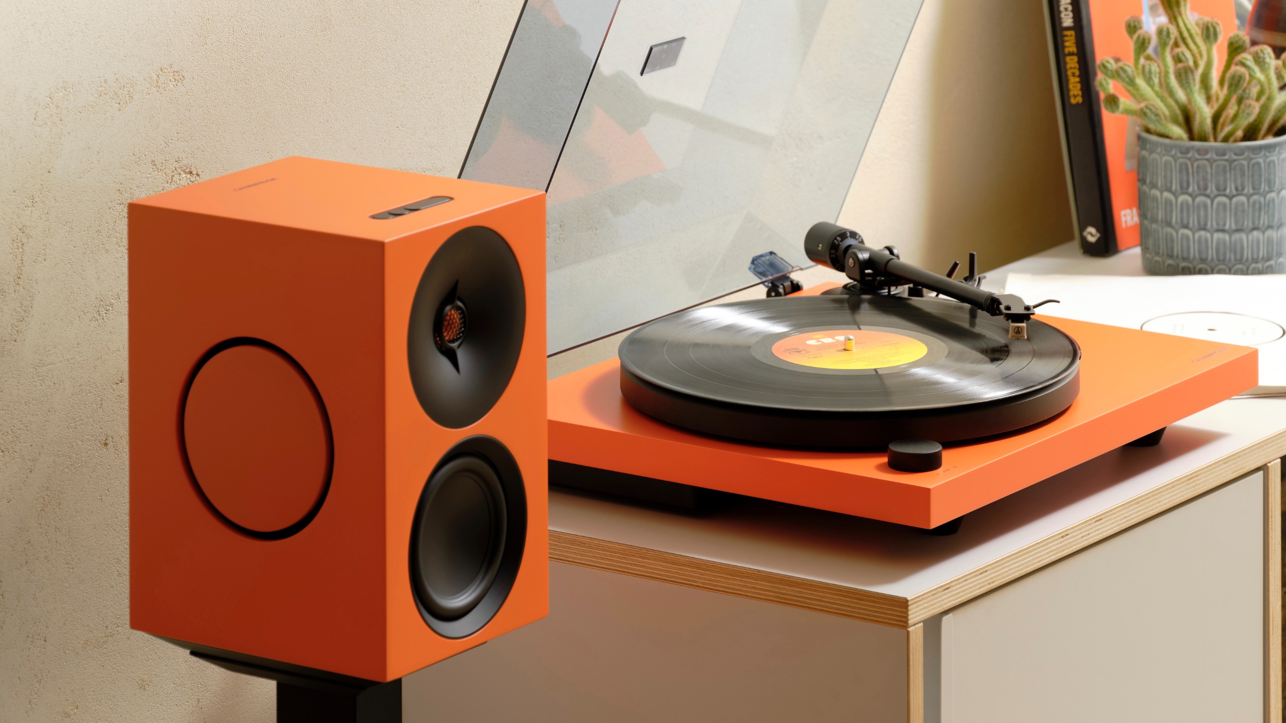Cambridge Audio Spira in orange next to L/R active speaker