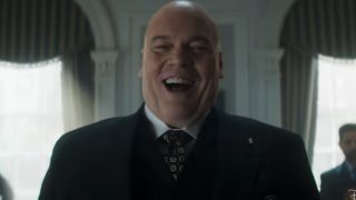 Vincent D'Onofrio with a big smile, wearing a suit as Kingpin in Daredevil: Born Again Season 2